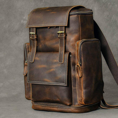 Practical and trendy 36-55L travel backpack in brown leather, with a retro touch