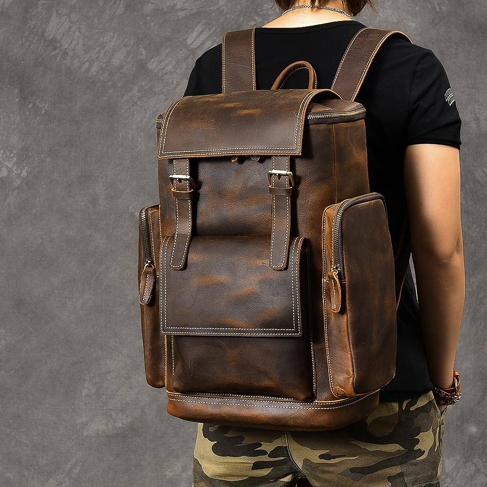 Explore confidently with a 36-55L retro brown leather travel backpack designed for men