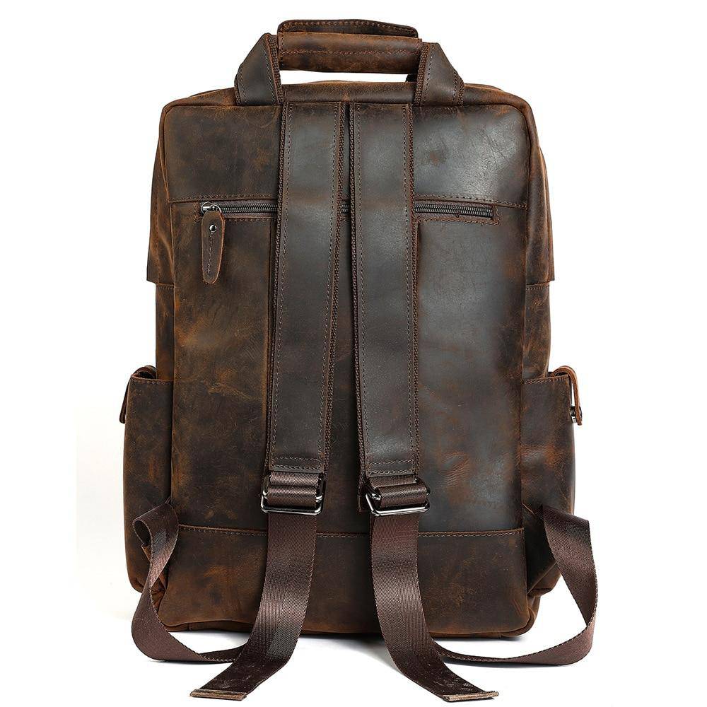 Chic travel-friendly daypack in brown genuine leather with adjustable volume