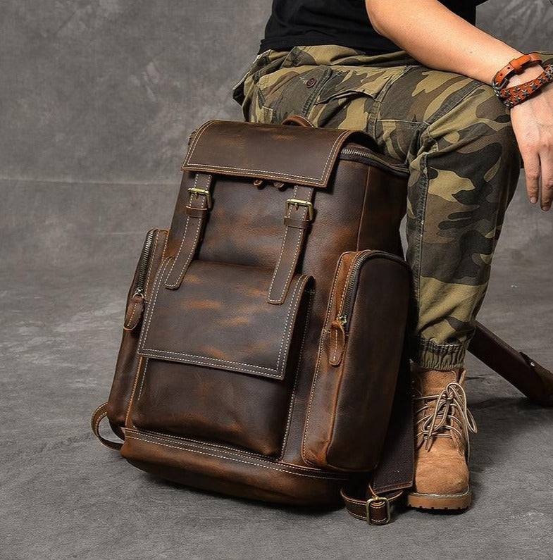 Men's travel-ready 36 to 55L brown leather backpack with a vintage feel