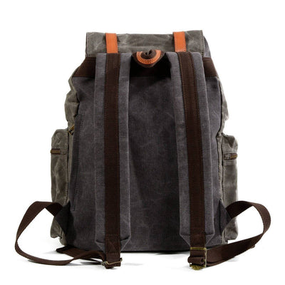 Travel-ready waterproof daypack in black and brown canvas and leather