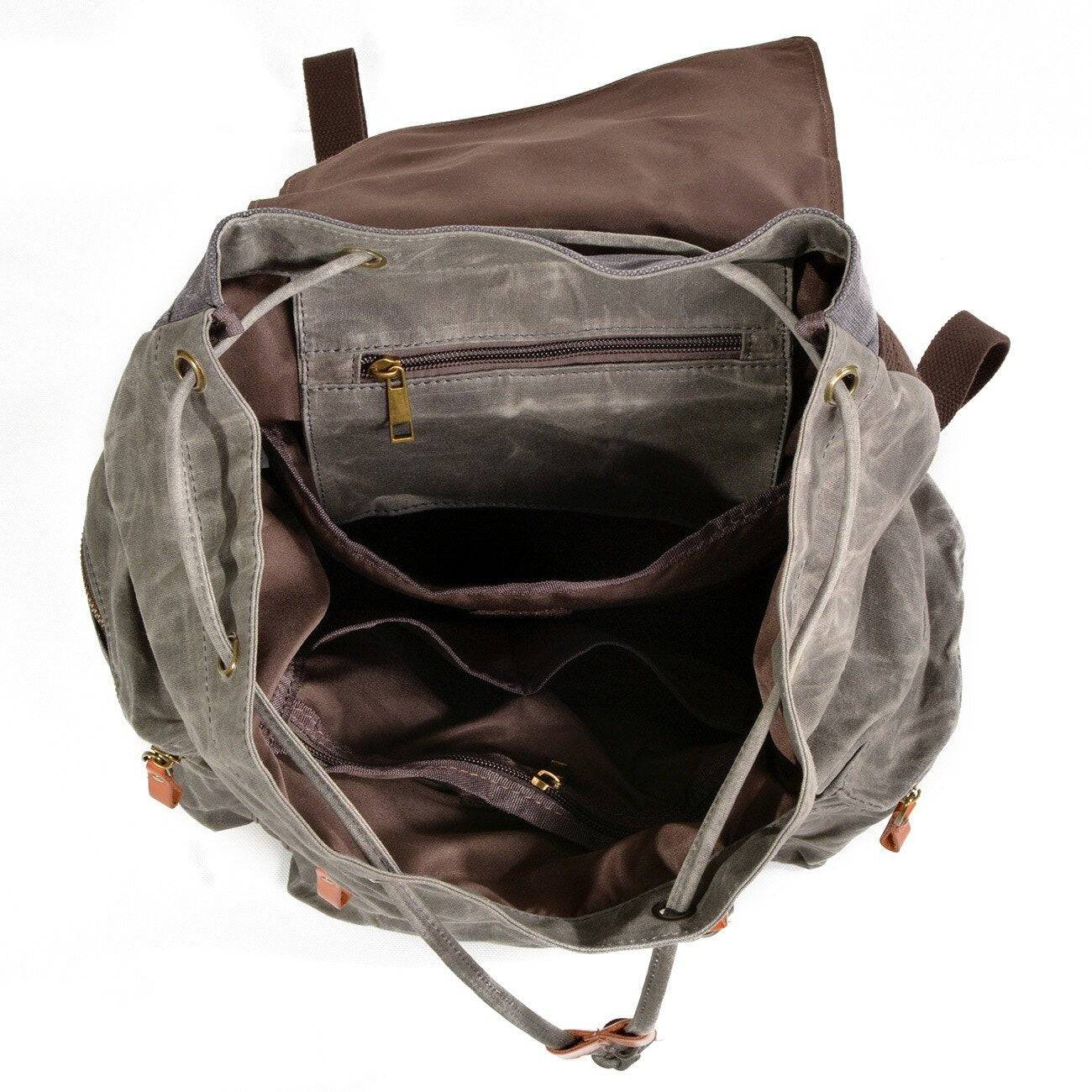 Functional and trendy backpack in waterproof canvas and leather, black and brown