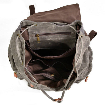 Functional and trendy backpack in waterproof canvas and leather, black and brown