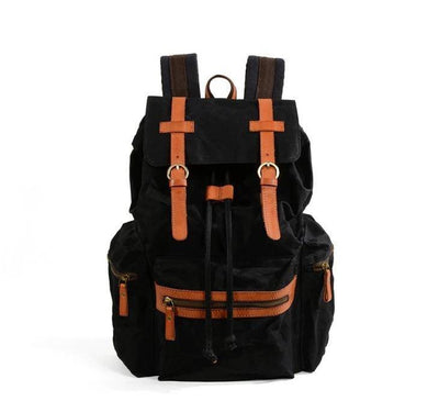 Versatile canvas leather backpack in black and brown with water-resistant features