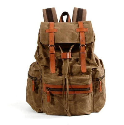 Explore in style with a black and brown waterproof canvas leather backpack