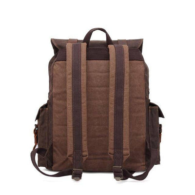 Explore in style with a large capacity canvas leather backpack